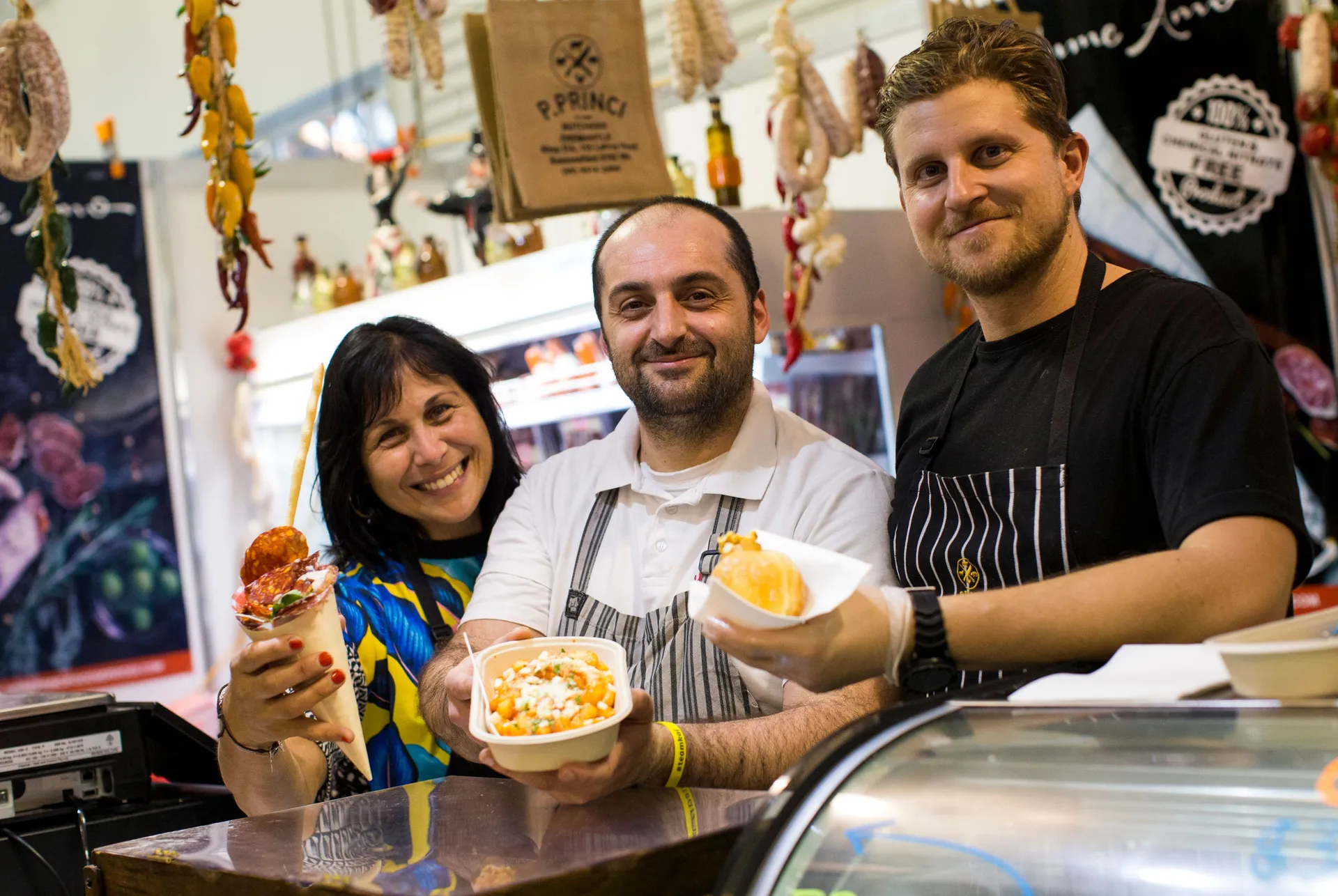 Vendors serving food at a Perth Royal food stall