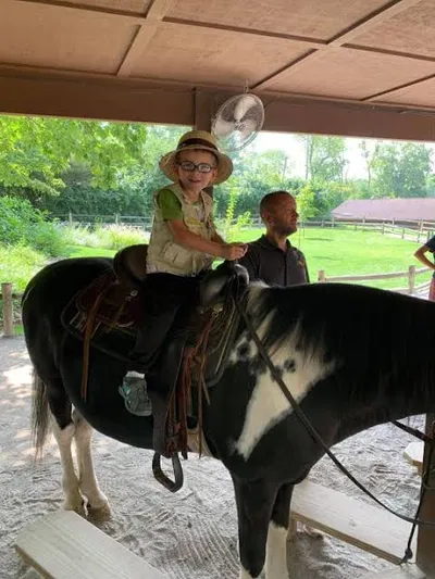 kid riding a pony