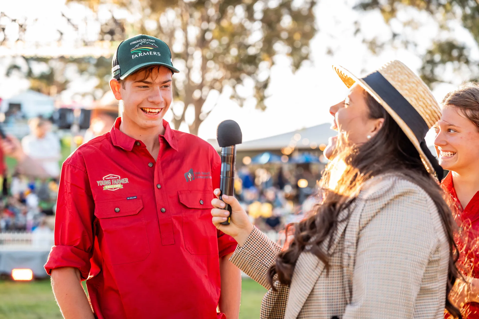 Young farmer being interviewed at an outdoor event
