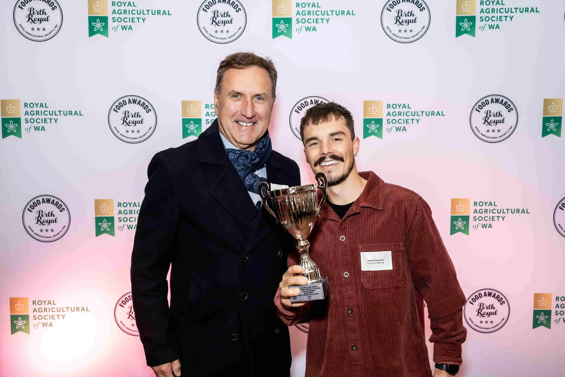 Award winners holding a trophy at the Perth Royal Food Awards.