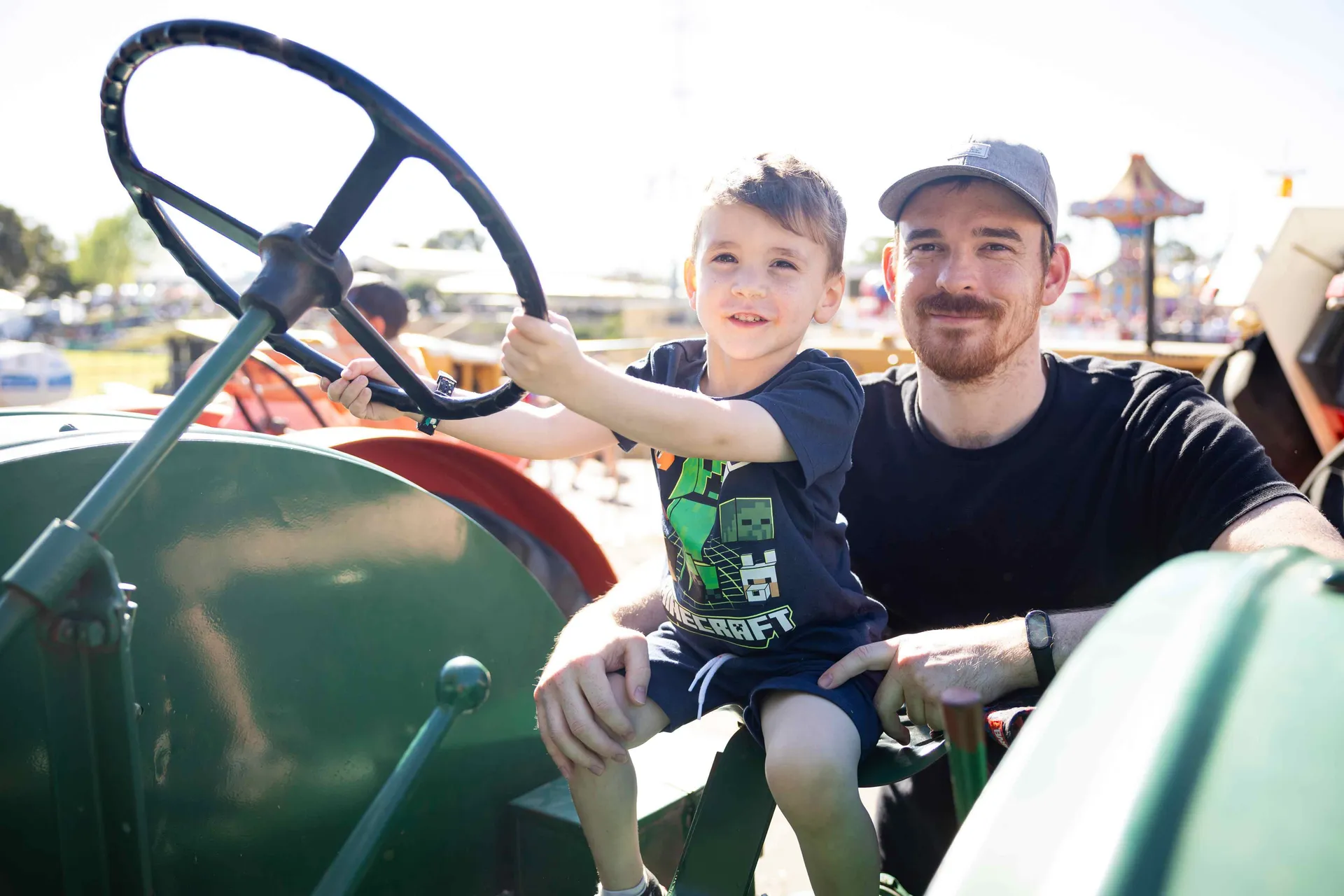 Man and child on Tractor