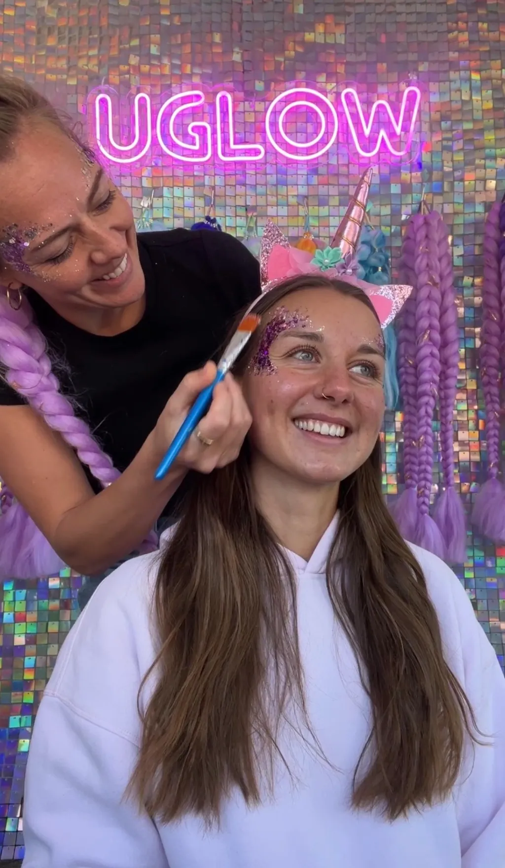 UGLOW giving a unicorn face paint