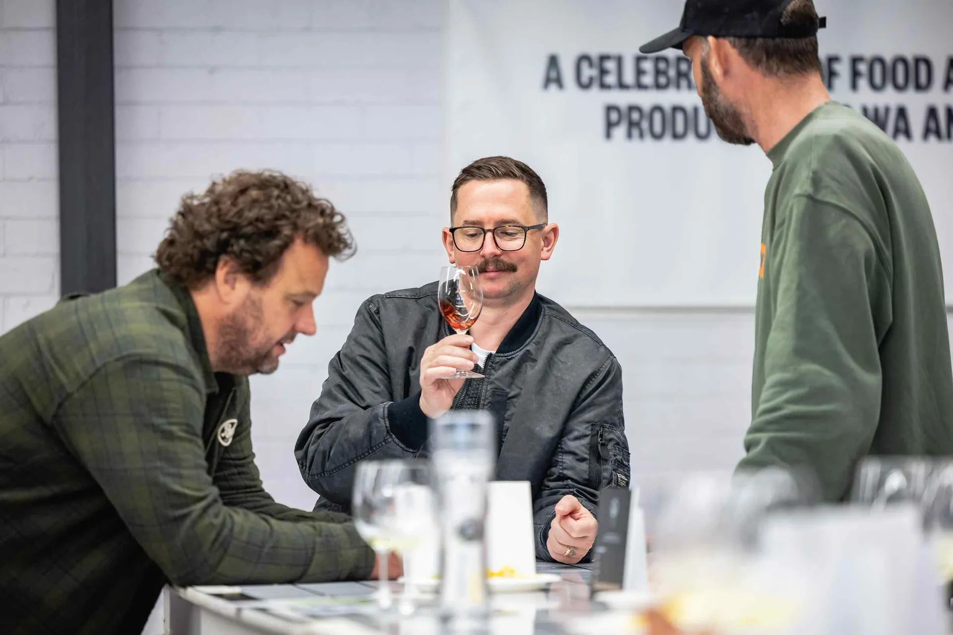 Judges assessing a drink sample at the Perth Royal Food Awards.
