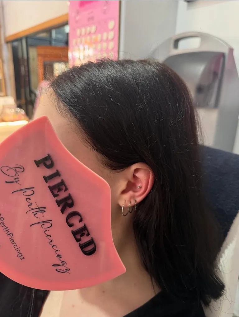 A women with her thirds piercing 