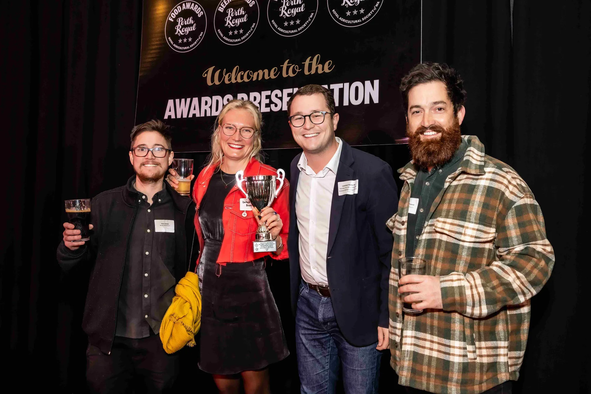 Award winners holding a trophy at the Perth Royal Food Awards.