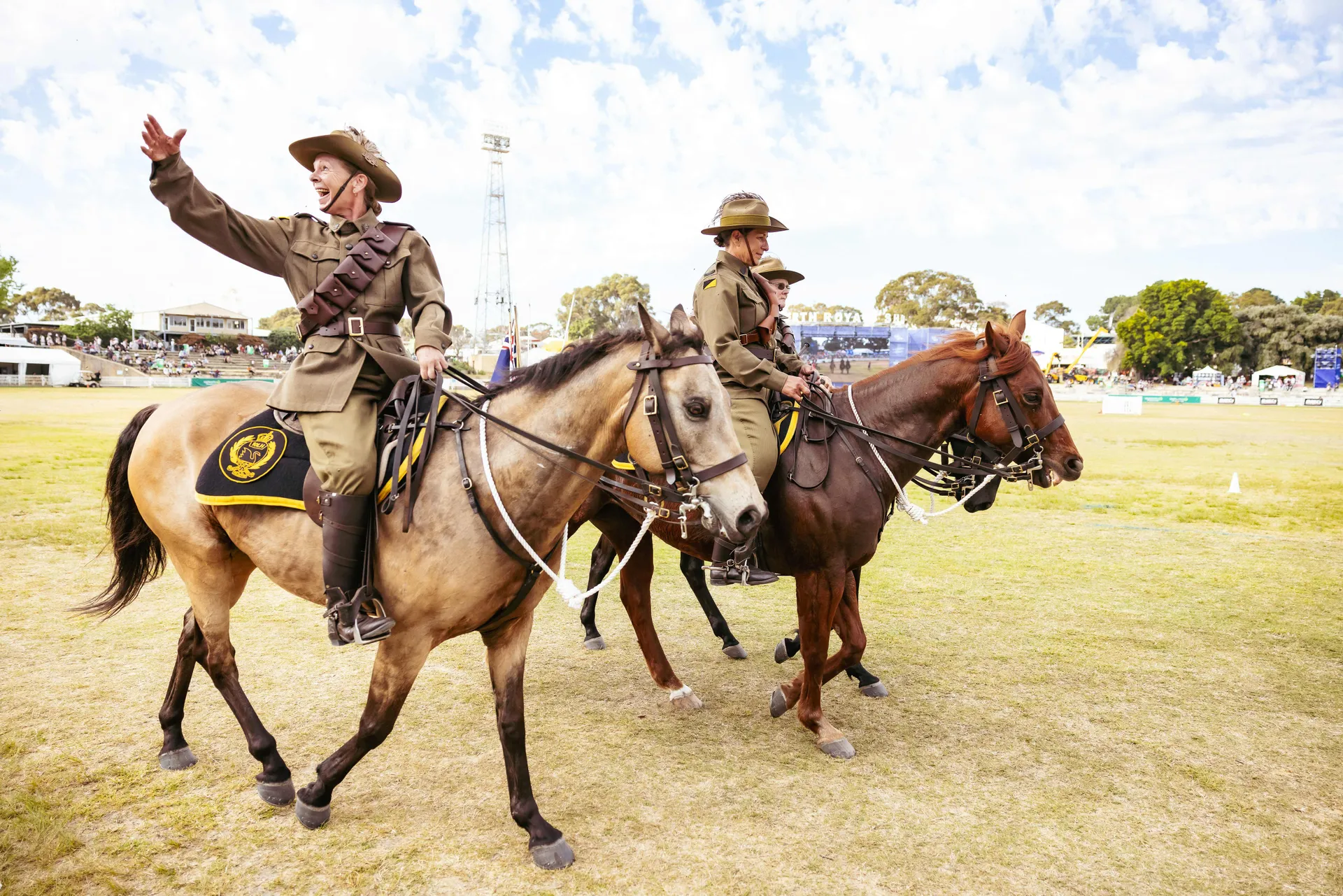 riders in uniform on horseback performing in an arena at the Perth Royal Show