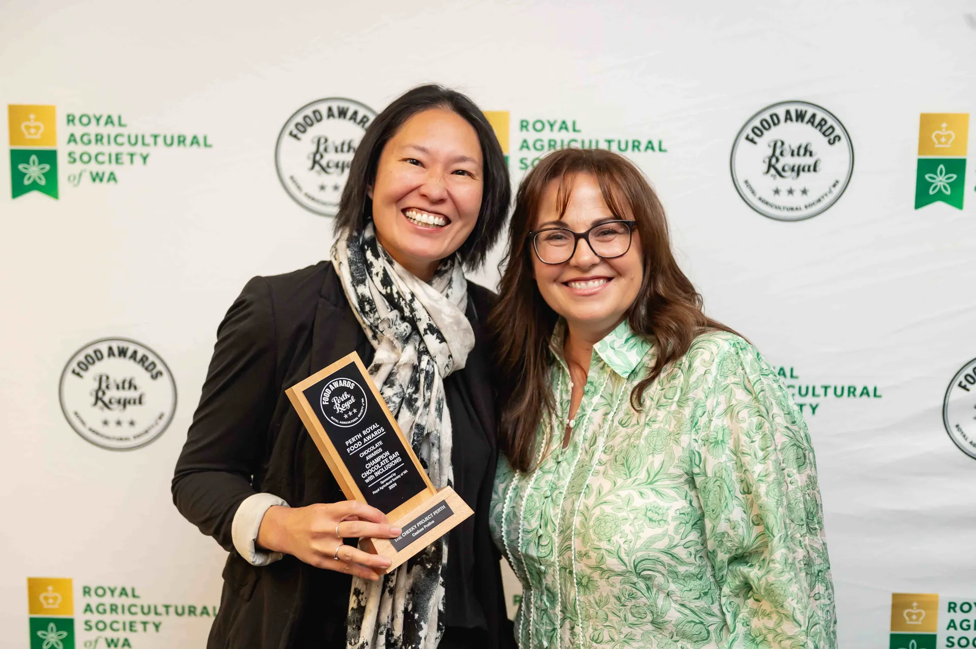 Award winners posing with a trophy at the Perth Royal Food Awards.