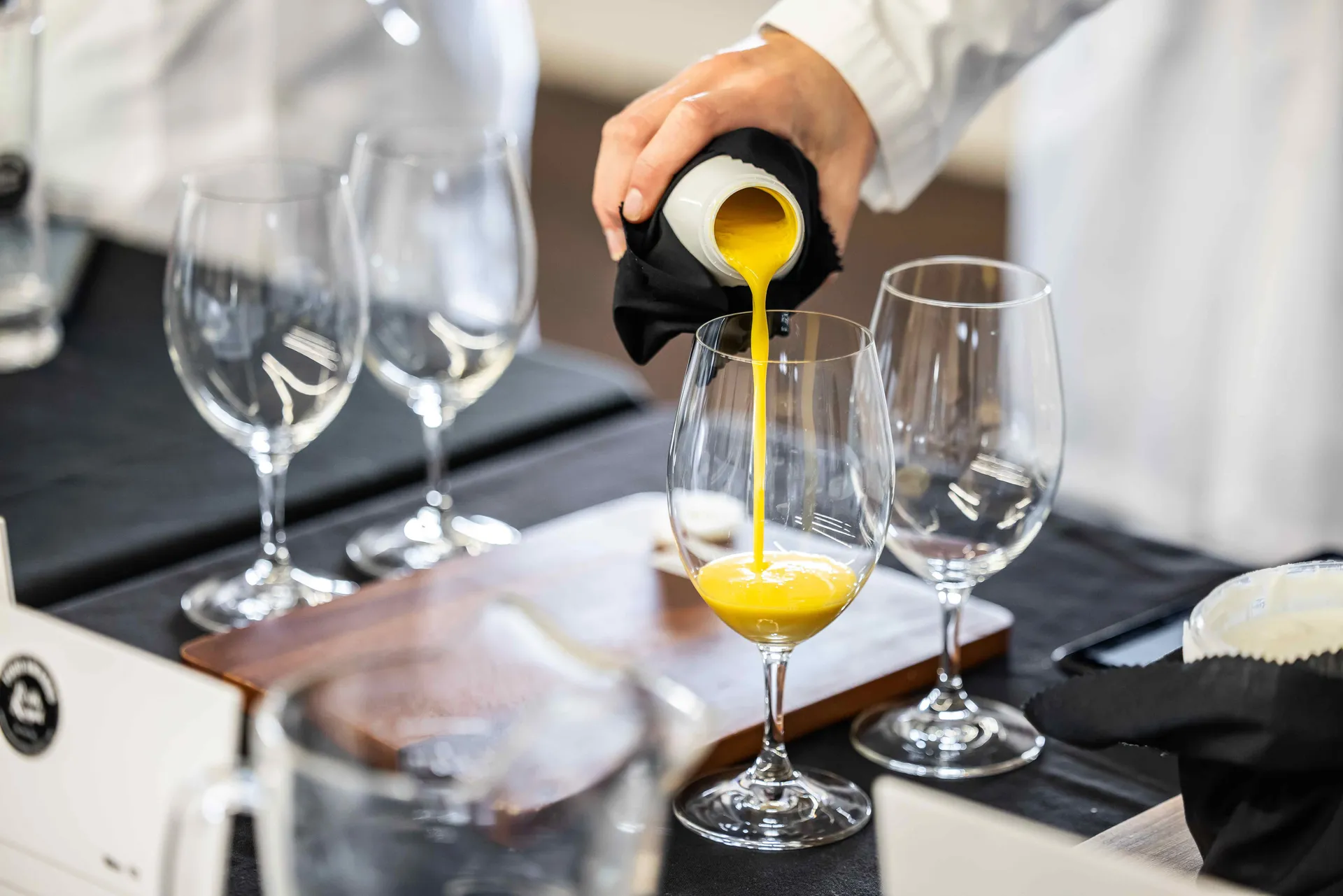 Dairy sample being poured for judging at the Perth Royal Food Awards.