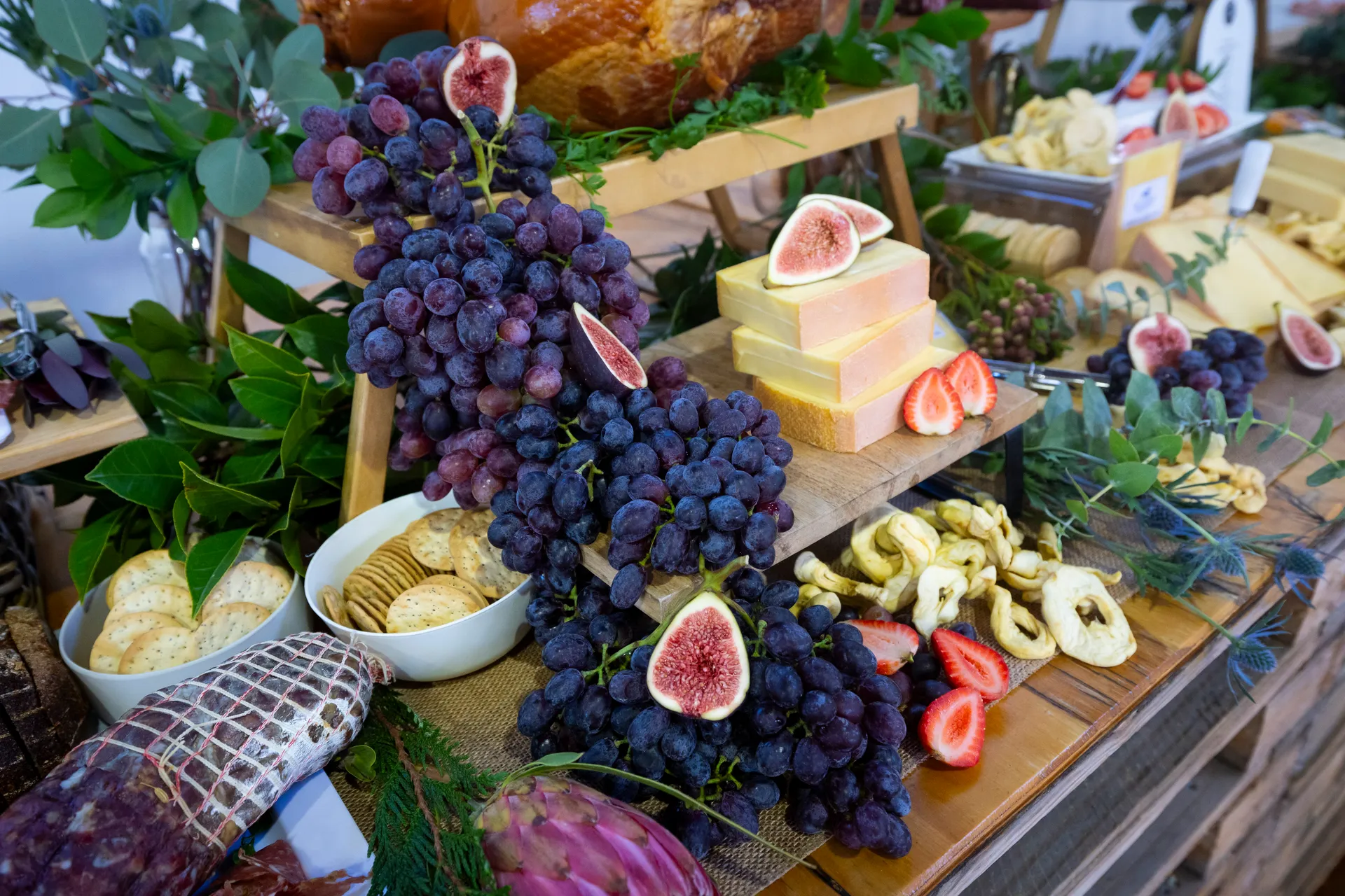 Artisan cheese and charcuterie display with grapes, figs, and crackers at the Perth Royal Food Awards
