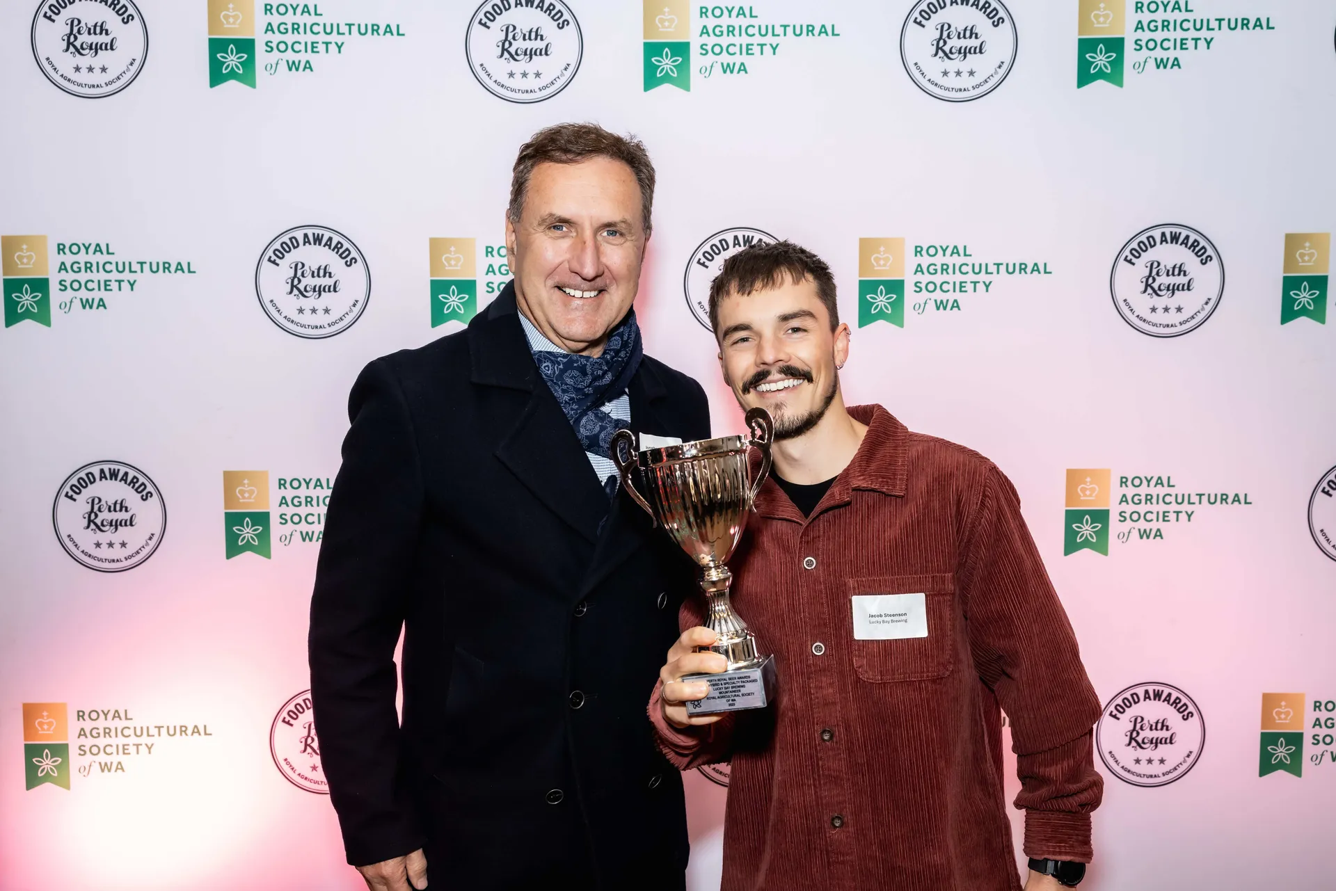 Award winner holding a trophy at the Perth Royal Food Awards