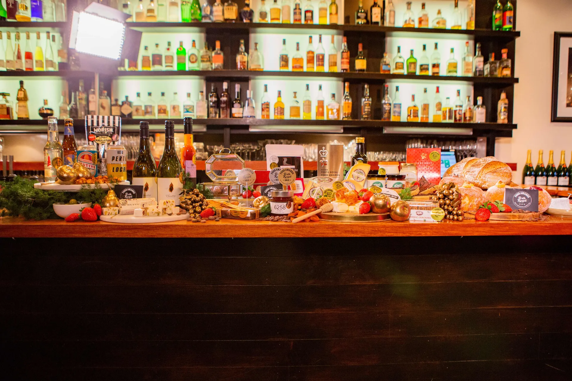 Display of award-winning food and beverages on a bar at the Perth Royal Food Awards