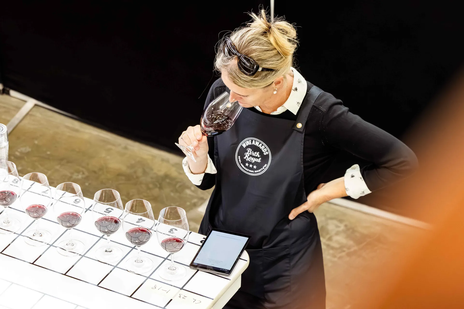 Judges reviewing wine samples at the Perth Royal Food Awards.