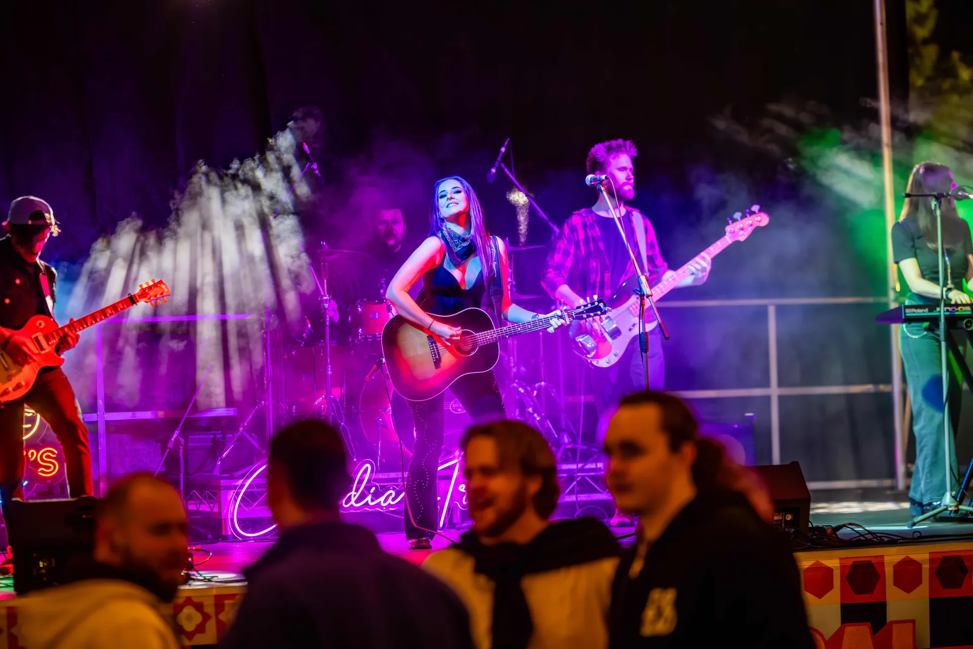 Live band performing on stage with colourful lights and smoke at the Perth Royal Show