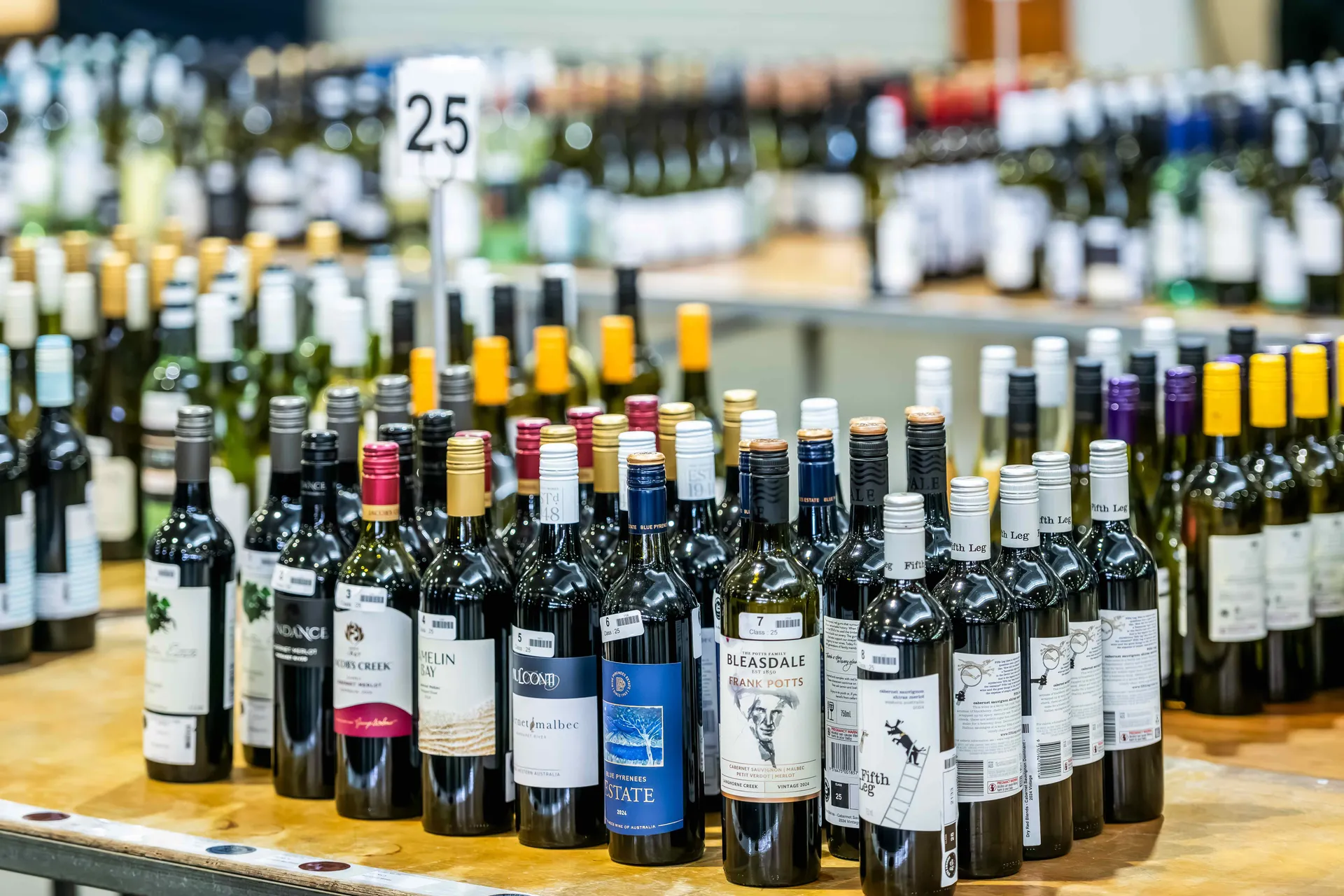 Wine bottles arranged for judging at the Perth Royal Food Awards.