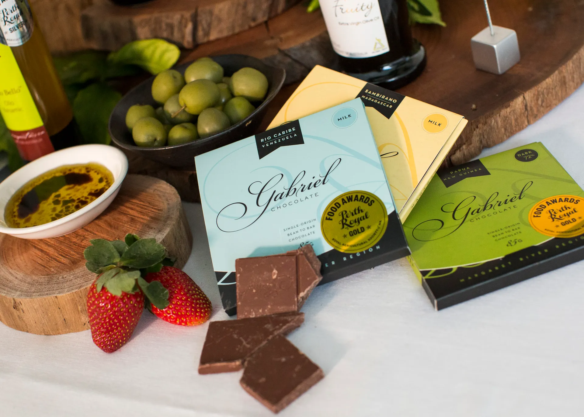 Staff member holding a beer bottle on a tray at the Perth Royal Beer Awards