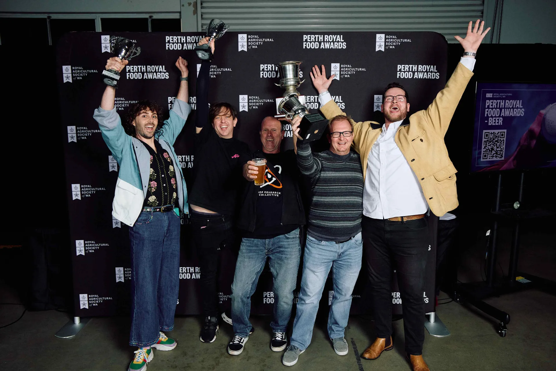 King Road Brewing Co team hold up their trophies and celebrate together at the Perth Royal Food Awards - Beer