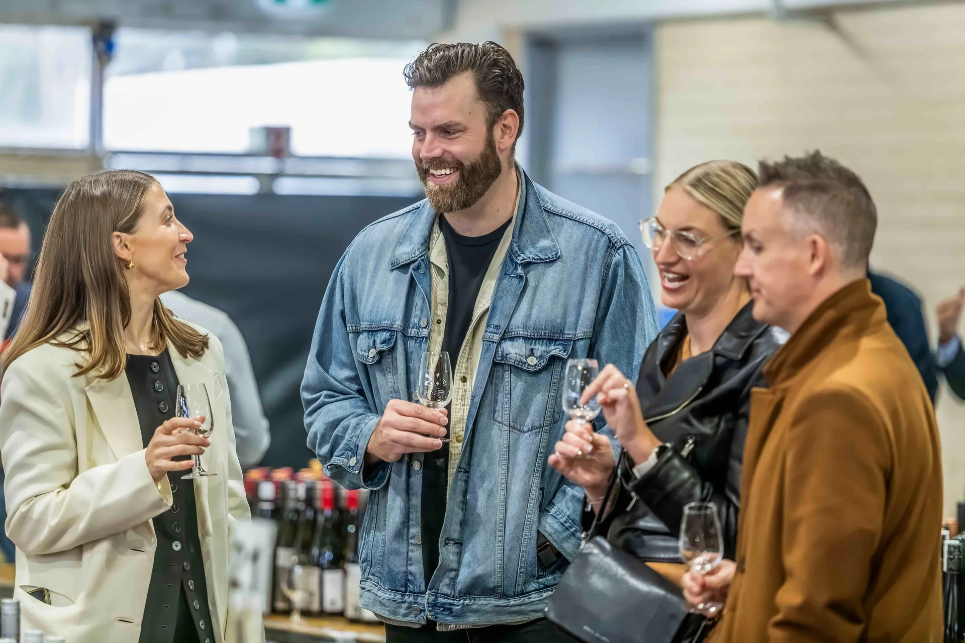 Guests enjoying wine tasting and conversation at the Perth Royal Food Awards.